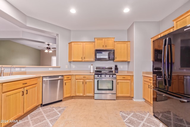 kitchen featuring ceiling fan, black appliances, sink, and light brown cabinetry