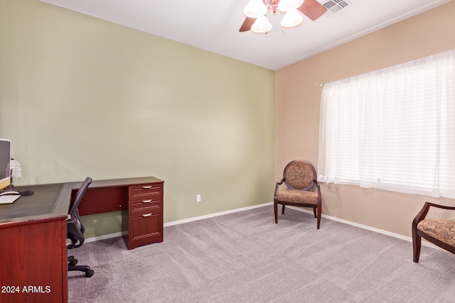 carpeted home office with ceiling fan