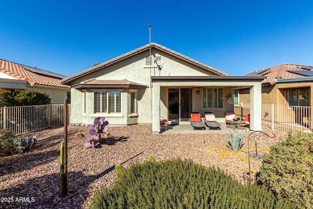 rear view of property featuring a patio