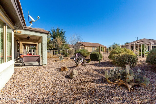 view of yard with a patio and ceiling fan