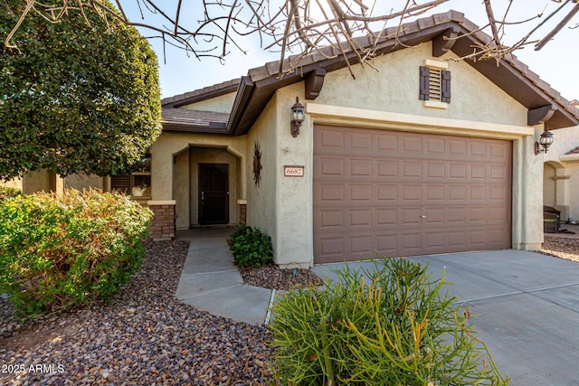 view of front of home with a garage