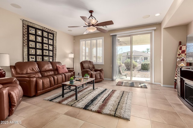 living room featuring ceiling fan and light tile patterned flooring