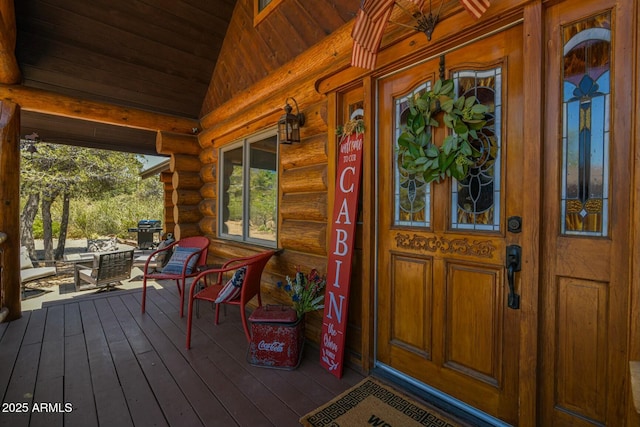 doorway to property with a porch