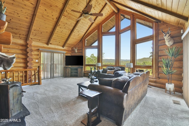 living room featuring beamed ceiling, carpet floors, high vaulted ceiling, and wooden ceiling