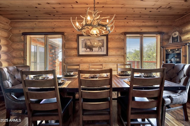 dining space featuring wood ceiling, a notable chandelier, hardwood / wood-style flooring, and rustic walls