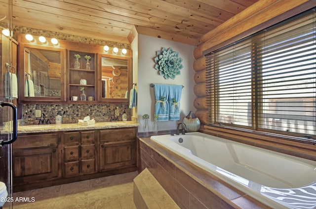 bathroom featuring wood ceiling, rustic walls, vanity, tasteful backsplash, and tiled bath