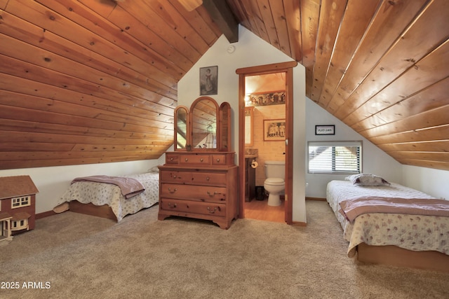 bedroom featuring light colored carpet, lofted ceiling with beams, wooden ceiling, and ensuite bathroom