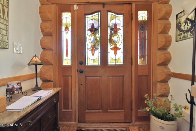 foyer featuring rustic walls