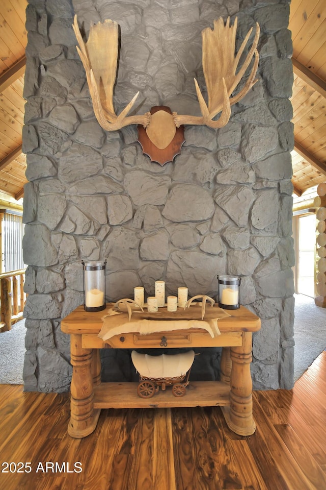 interior details featuring wood ceiling, hardwood / wood-style floors, and beamed ceiling