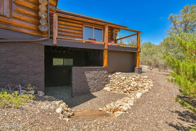 view of home's exterior with a wooden deck