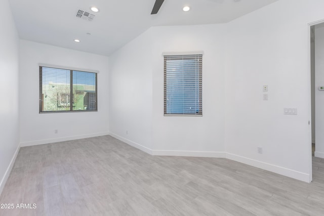 unfurnished room featuring recessed lighting, visible vents, and light wood-style flooring