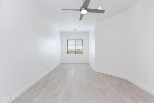 unfurnished room with light wood-style flooring, baseboards, and ceiling fan