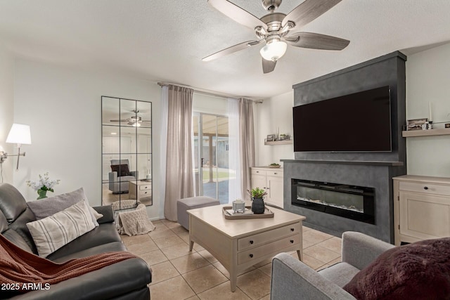 9825 N 44th Ave, Glendale, AZ 85302 - living area with ceiling fan, a glass covered fireplace, light tile patterned floors, and a textured ceiling