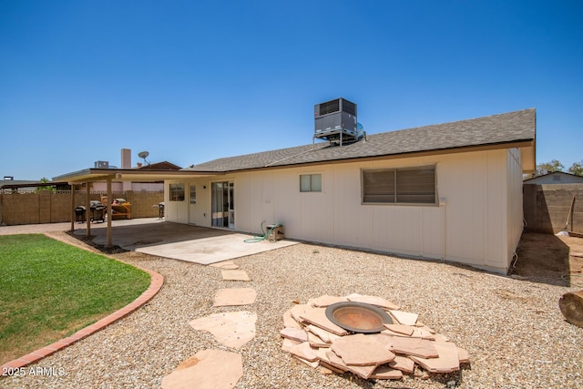 9825 N 44th Ave, Glendale, AZ 85302 - back of property with a fenced backyard, a patio, a fire pit, and roof with shingles