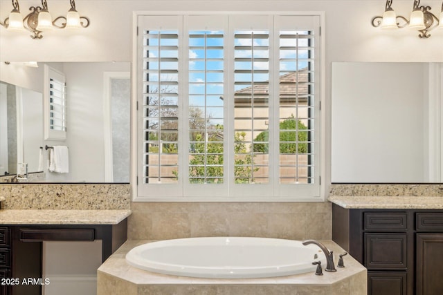 full bathroom with a garden tub and vanity