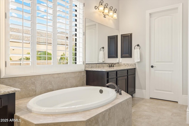 bathroom featuring a bath and vanity