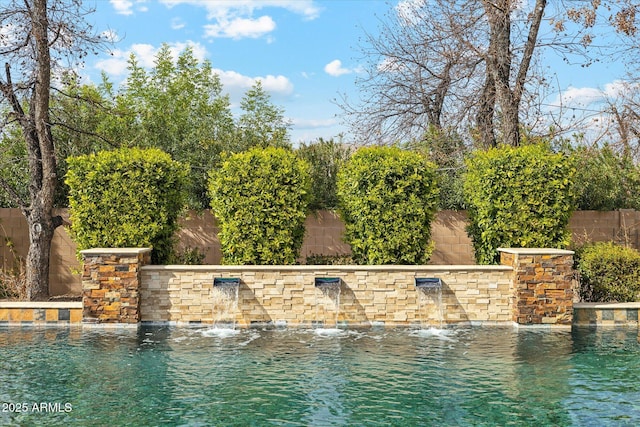 view of pool featuring a fenced backyard