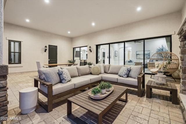 living area with recessed lighting and a ceiling fan