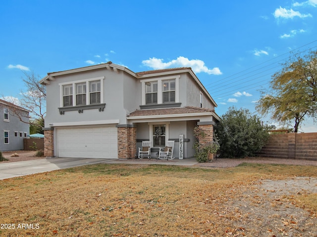 front of property featuring a garage and a front lawn