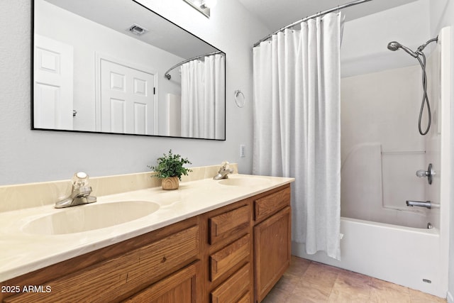 bathroom with double vanity, shower / bath combo, a sink, and visible vents