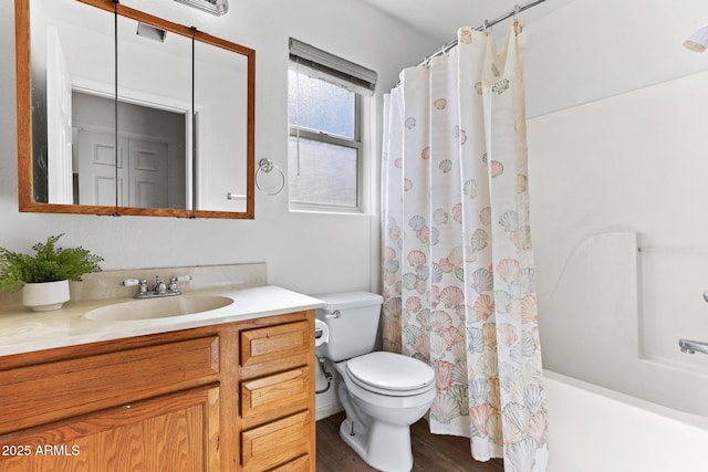 full bath with wood finished floors, vanity, toilet, and shower / tub combo with curtain