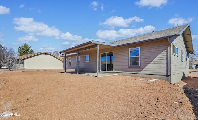 rear view of property featuring a patio area