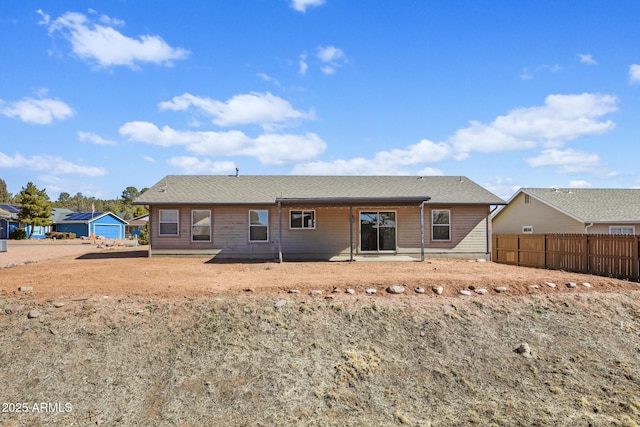 back of house featuring a patio area and fence