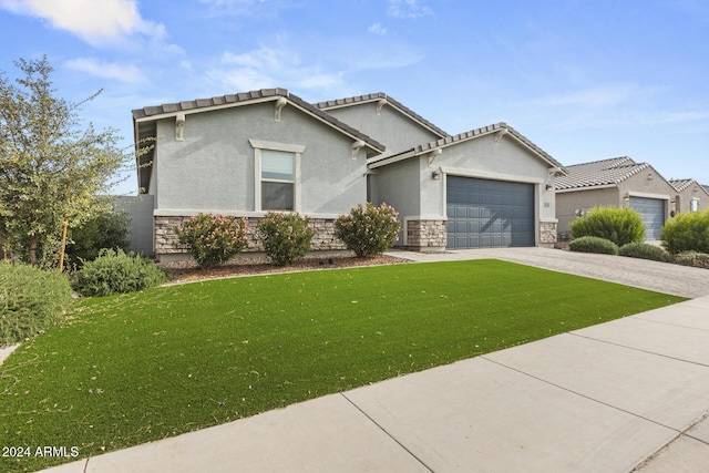 view of front facade featuring a front lawn and a garage