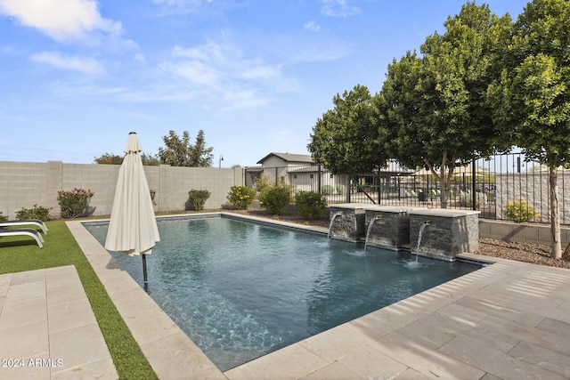 view of swimming pool featuring pool water feature