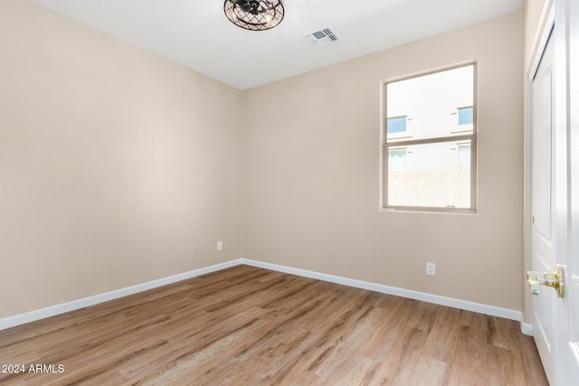 spare room featuring light hardwood / wood-style flooring