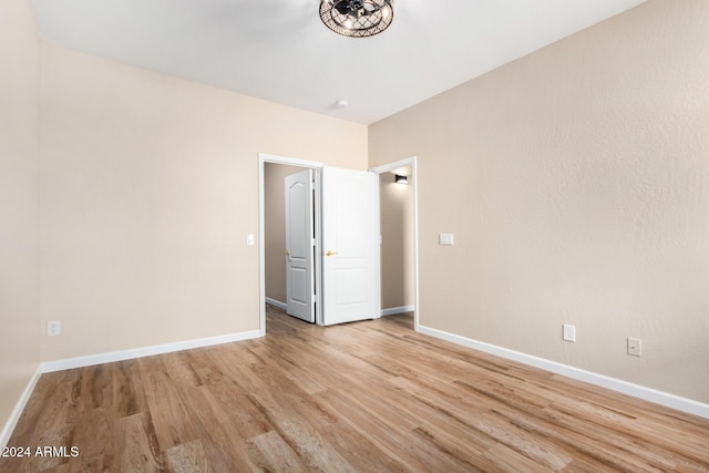 unfurnished bedroom featuring light wood-type flooring