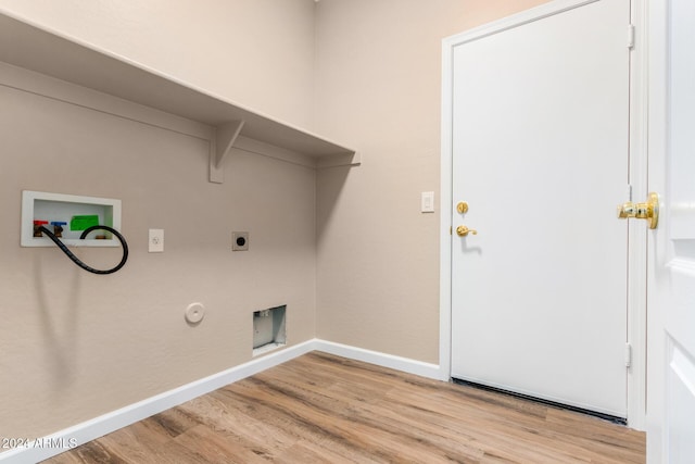 laundry room featuring washer hookup, electric dryer hookup, light hardwood / wood-style floors, and gas dryer hookup