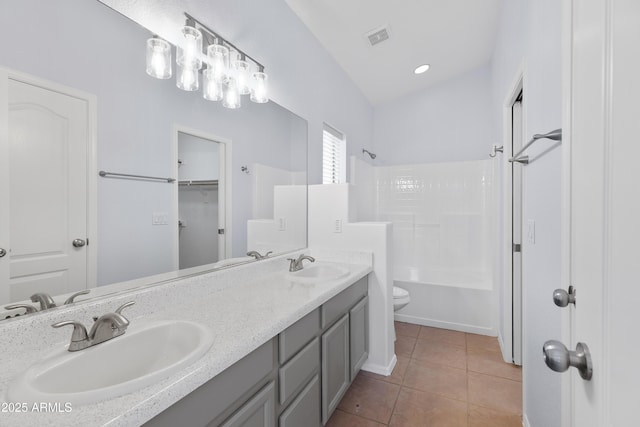 full bathroom with bathtub / shower combination, visible vents, a sink, and tile patterned floors