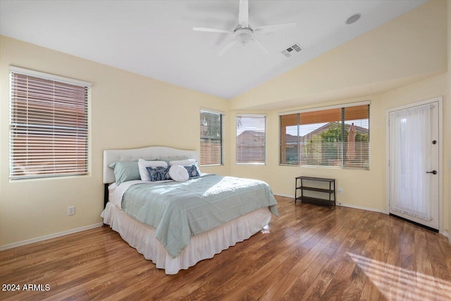 bedroom featuring hardwood / wood-style floors, ceiling fan, and lofted ceiling