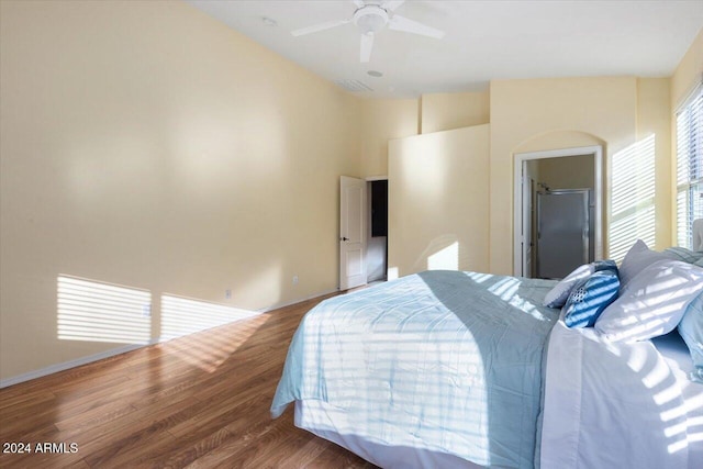 bedroom with hardwood / wood-style flooring and ceiling fan