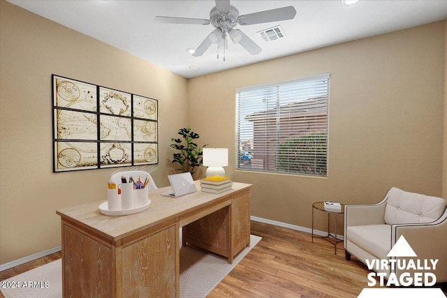 home office with ceiling fan and light wood-type flooring