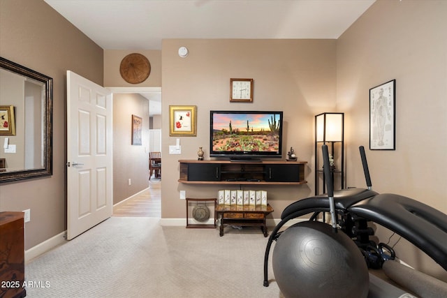 interior space with carpet flooring and baseboards