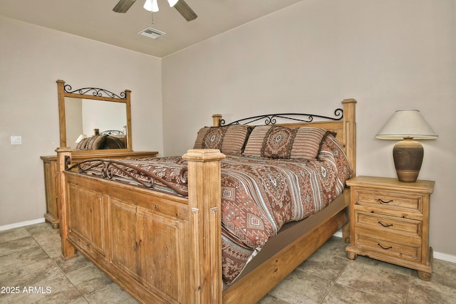 bedroom with visible vents, baseboards, and a ceiling fan