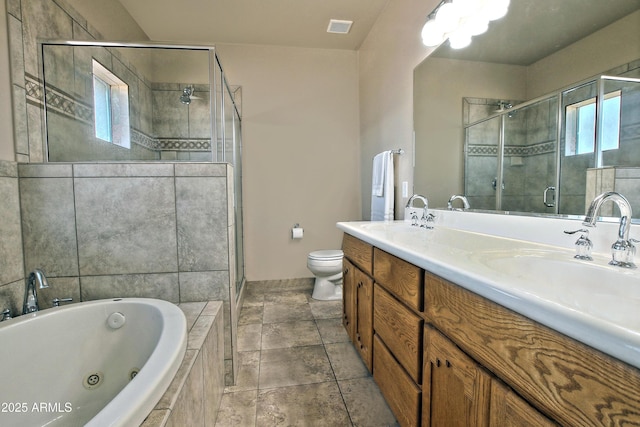 full bath with visible vents, a sink, a jetted tub, a shower stall, and double vanity