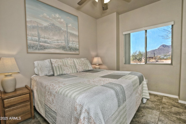 bedroom featuring baseboards and ceiling fan