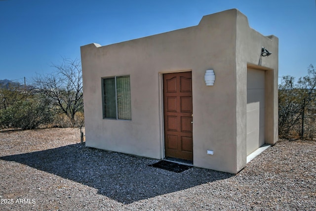 exterior space featuring stucco siding