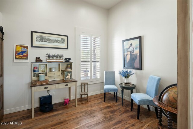 sitting room featuring wood finished floors and baseboards