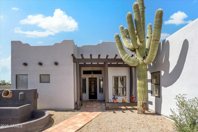 back of property with stucco siding