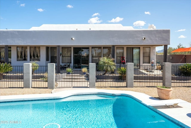 view of pool with a fenced in pool, fence, and a patio