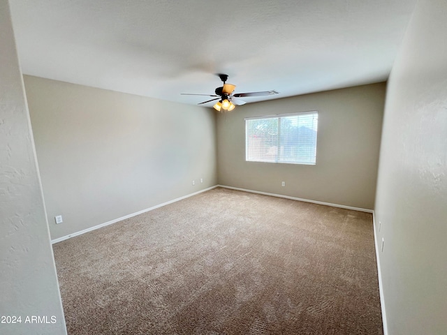 unfurnished room featuring carpet and ceiling fan