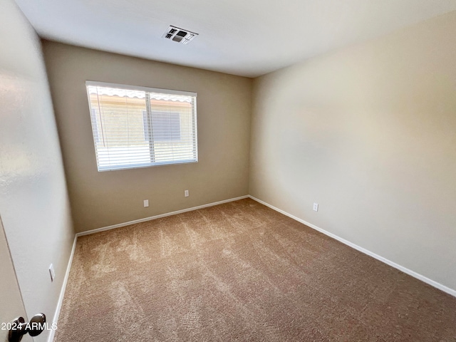 unfurnished room featuring carpet flooring