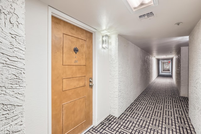 7970 E Camelback Rd Unit 110, Scottsdale, AZ 85251 - hall with visible vents and brick patterned floor