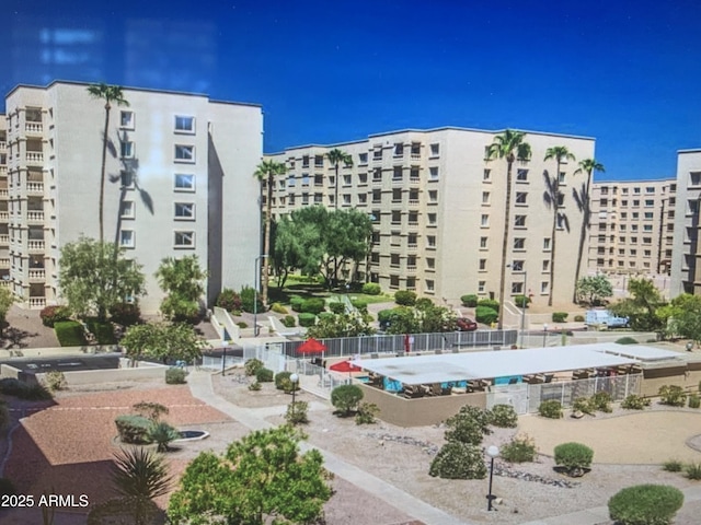 7970 E Camelback Rd Unit 110, Scottsdale, AZ 85251 - view of building exterior with fence