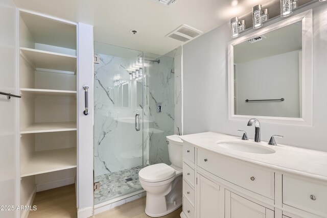 7970 E Camelback Rd Unit 110, Scottsdale, AZ 85251 - full bath with a marble finish shower, vanity, toilet, and visible vents