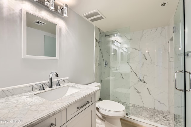7970 E Camelback Rd Unit 110, Scottsdale, AZ 85251 - bathroom with toilet, visible vents, a marble finish shower, and vanity